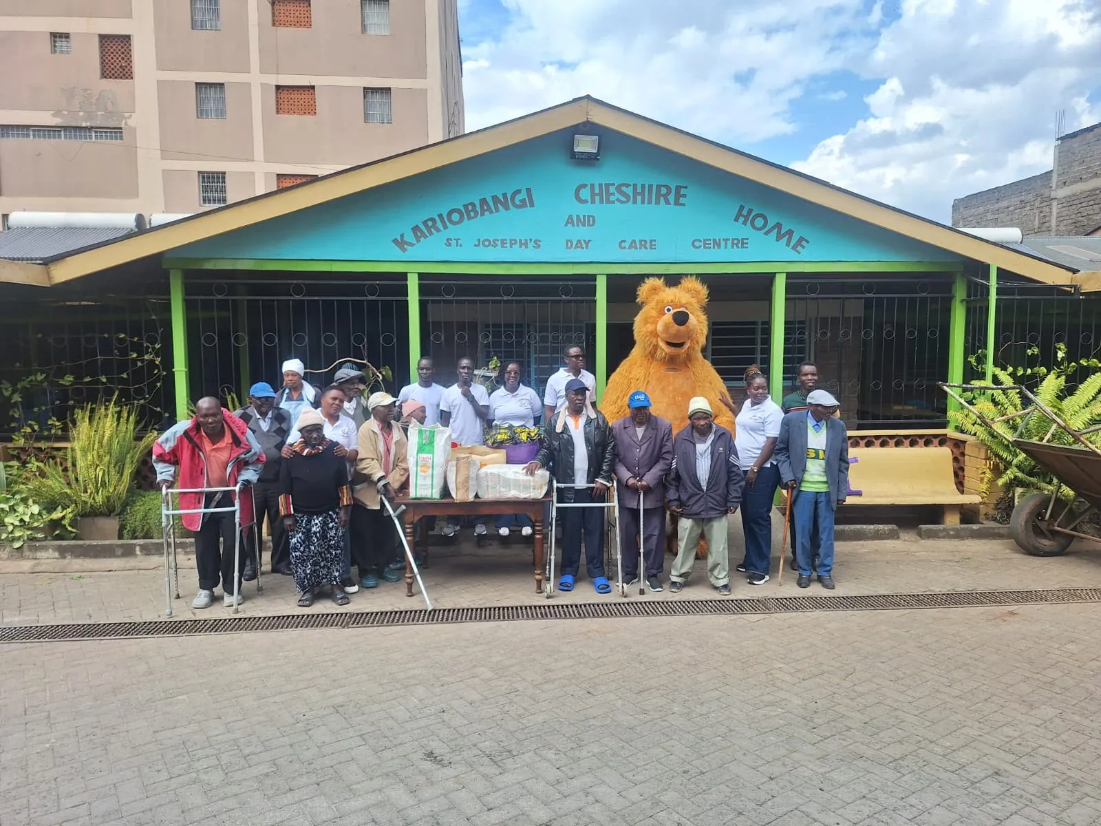 Volunteers and seniors outside Kariobangi Cheshire Home and St. Joseph’s Day Care Centre