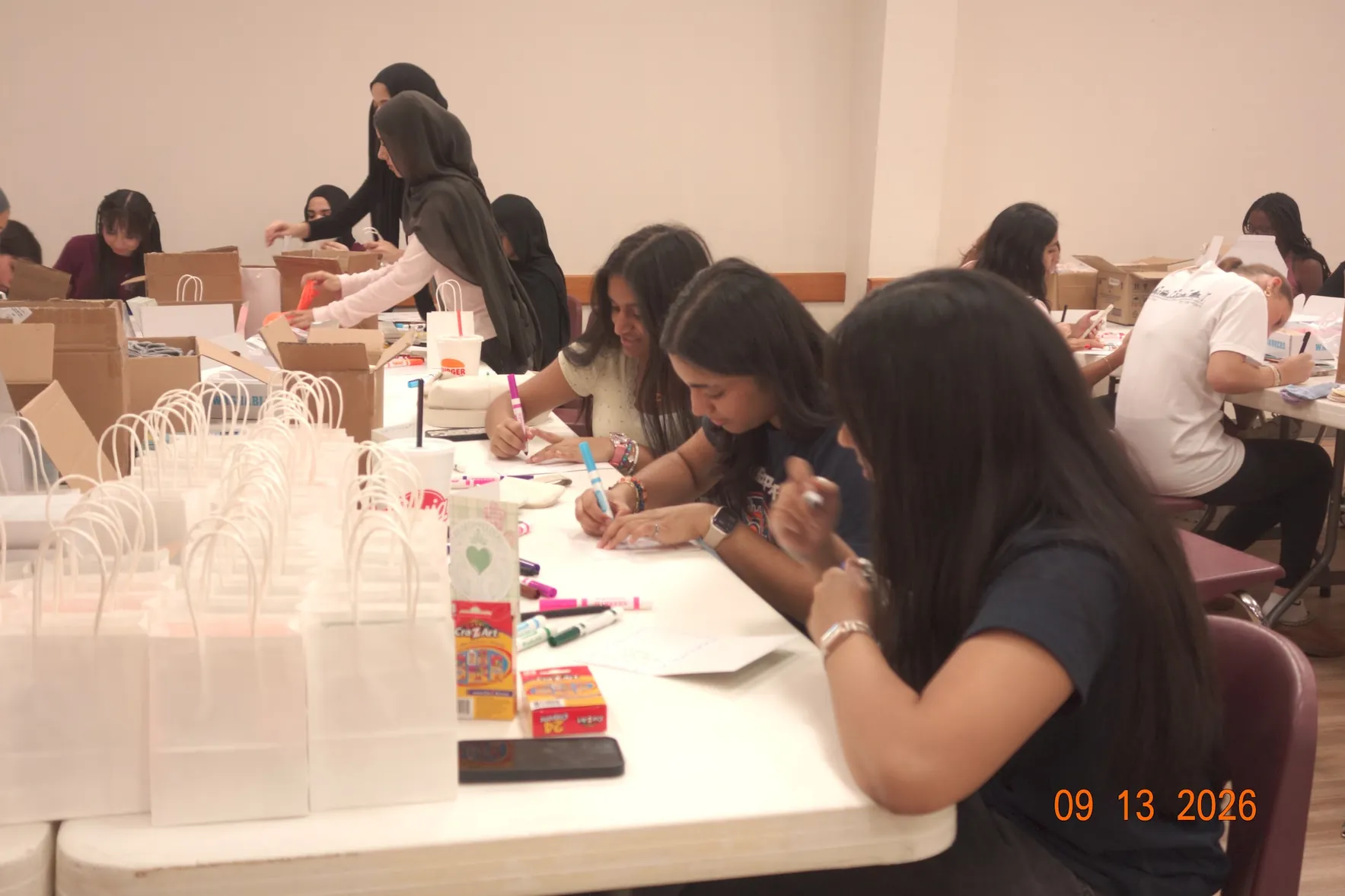 Volunteers preparing cards and care packages at the Katy Elks Lodge event
