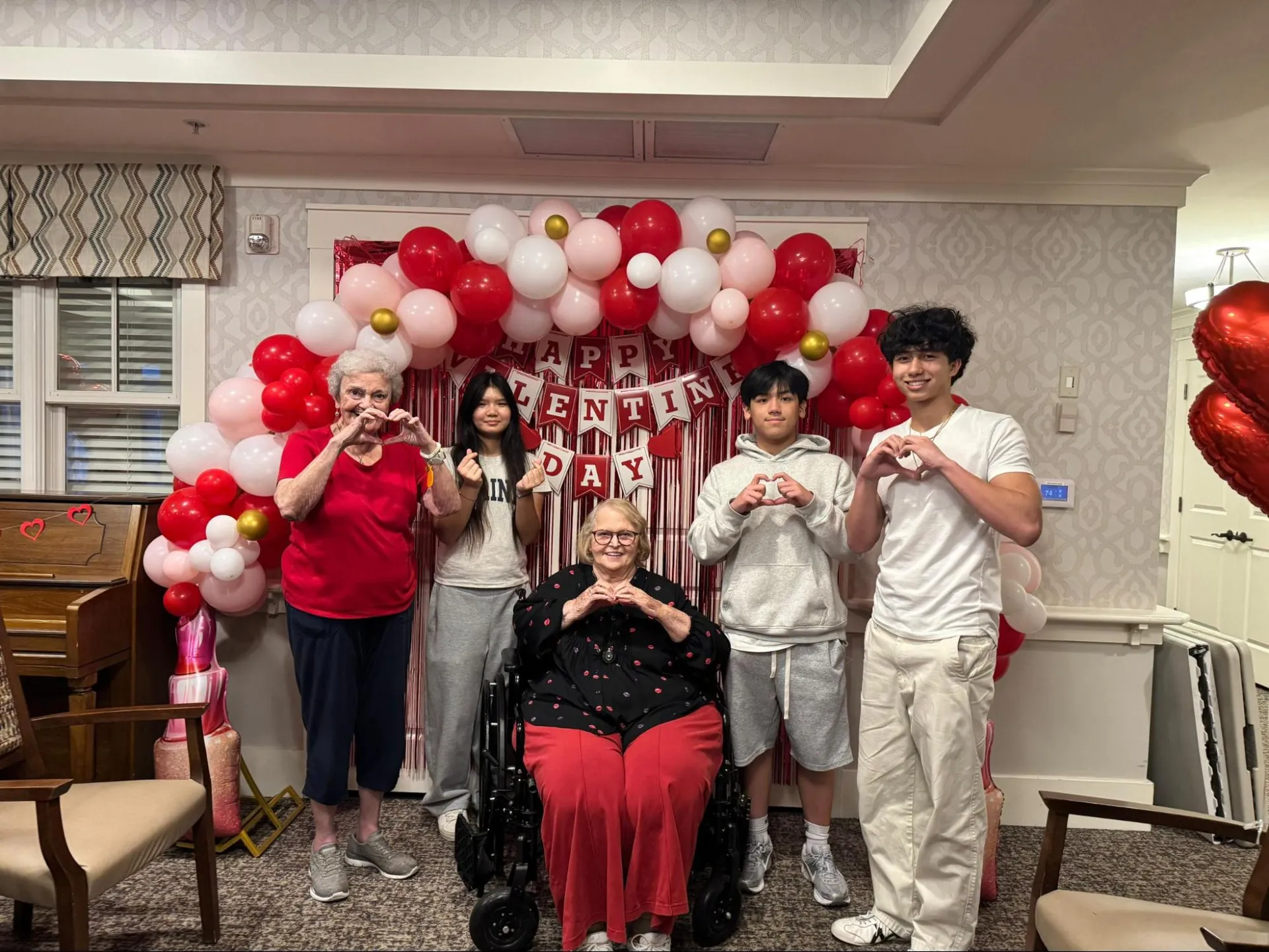 Hearts for Elders volunteers and seniors together during a community visit